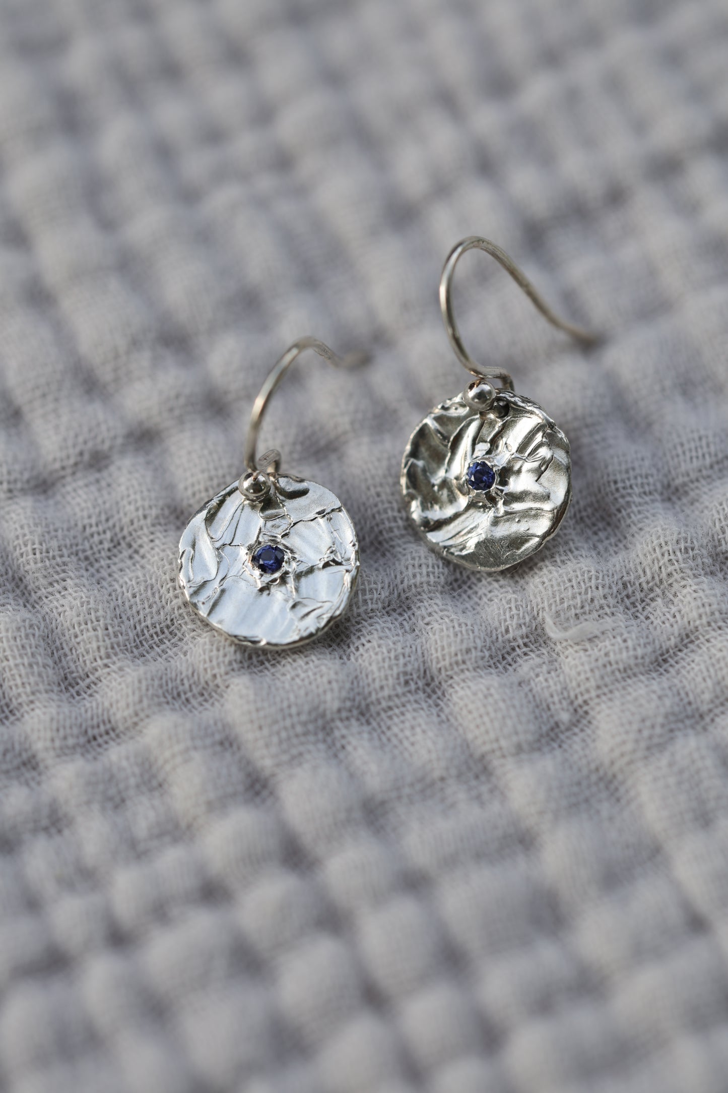 Small one of a kind blue sapphire earrings textured