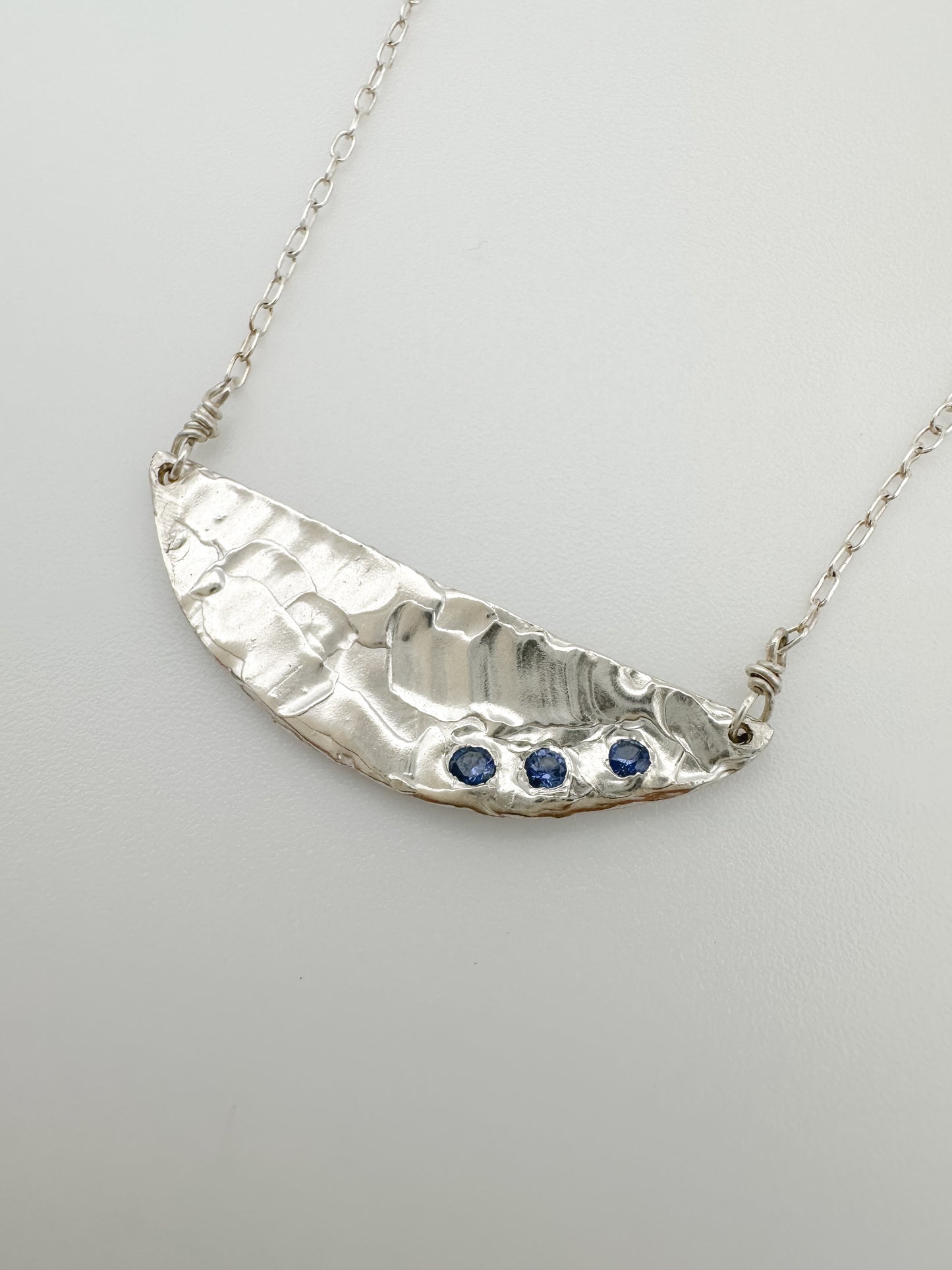 DEMI LUNE | 3 blue sapphires nestled in half moon necklace with recycled sterling silver