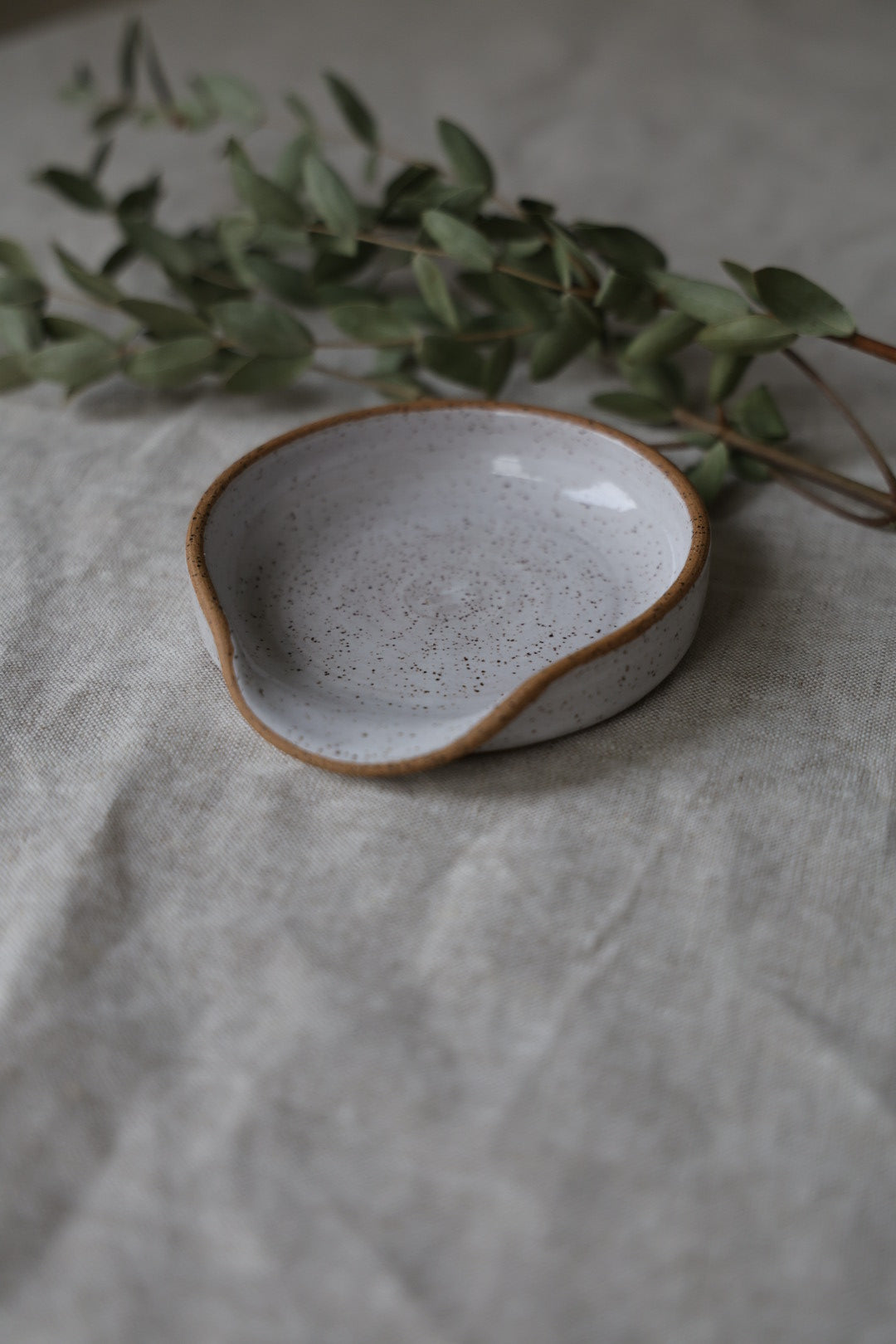Spoon rest in speckled ceramic, kitchenware pottery, rustic, handmade, artful home, white, pink, or green.