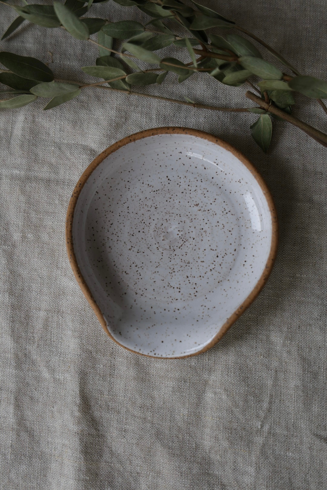 Spoon rest in speckled ceramic, kitchenware pottery, rustic, handmade, artful home, white, pink, or green.