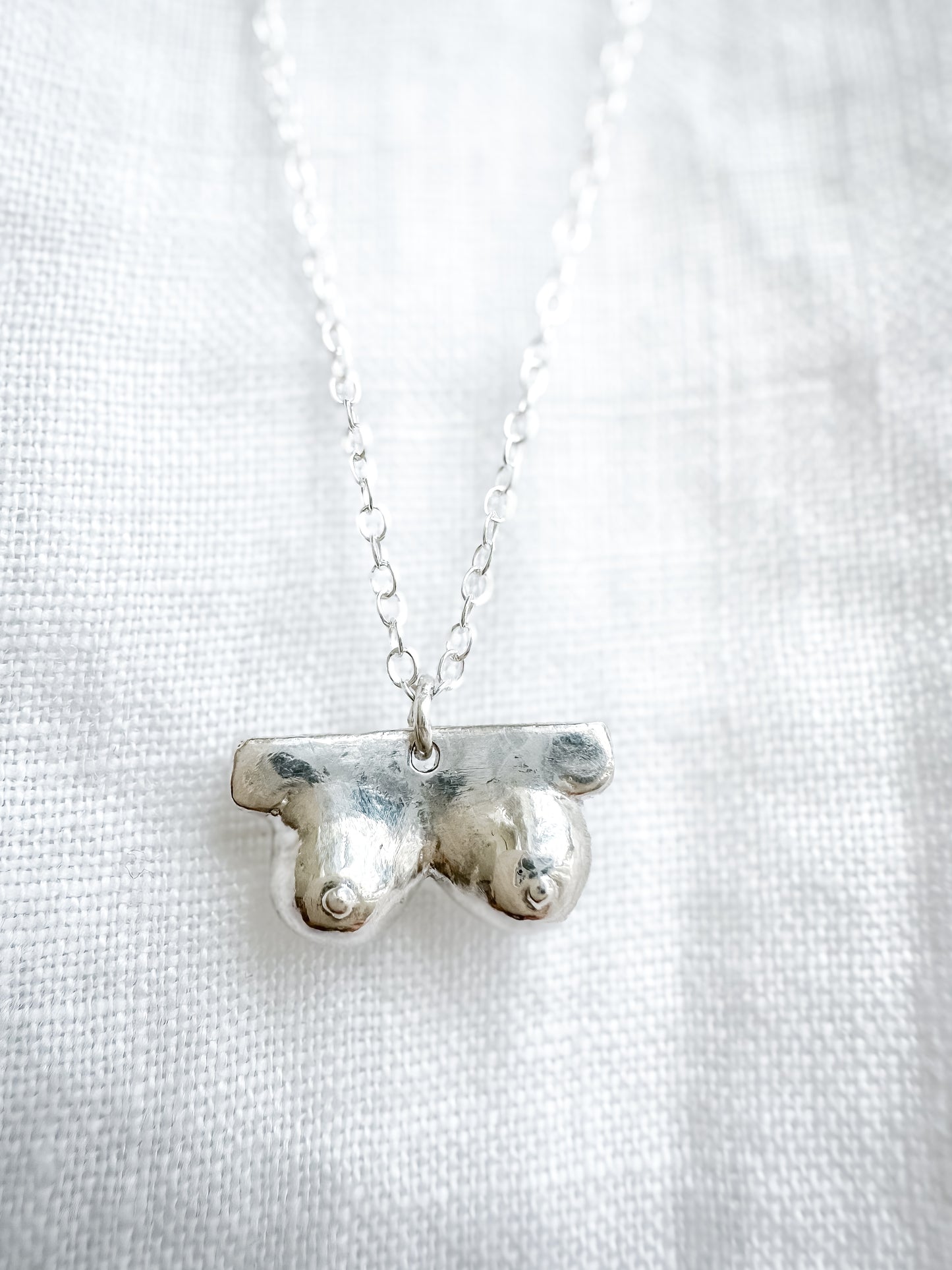 Boob necklace sterling silver breast necklace, hand-carved in Maine, adjustable chain, recycled silver