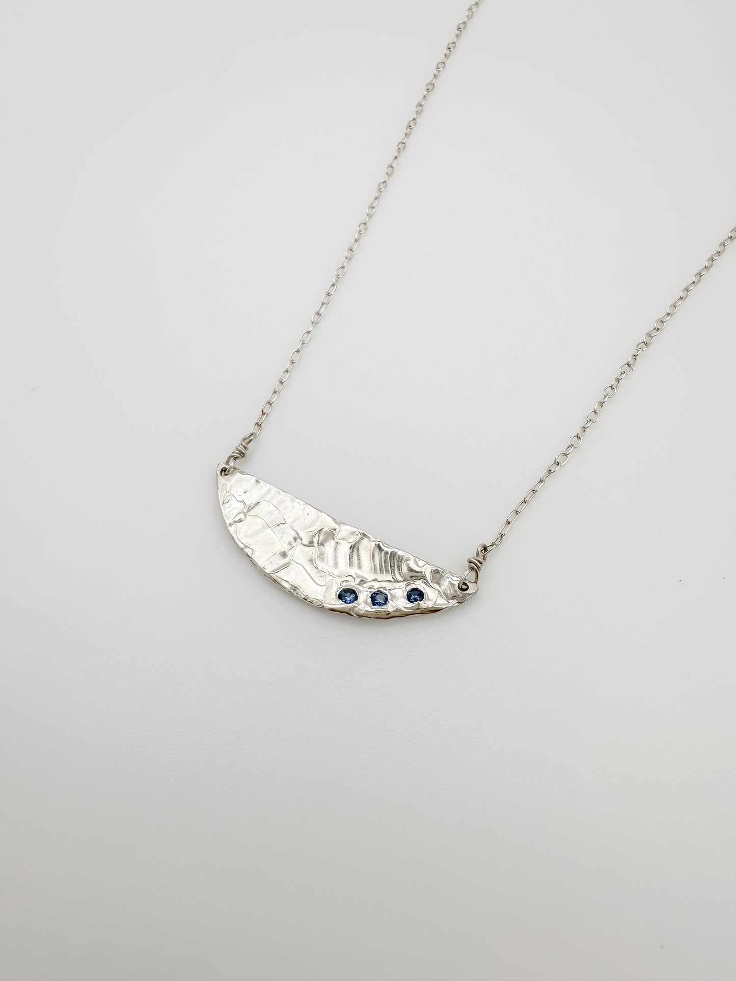 DEMI LUNE | 3 blue sapphires nestled in half moon necklace with recycled sterling silver