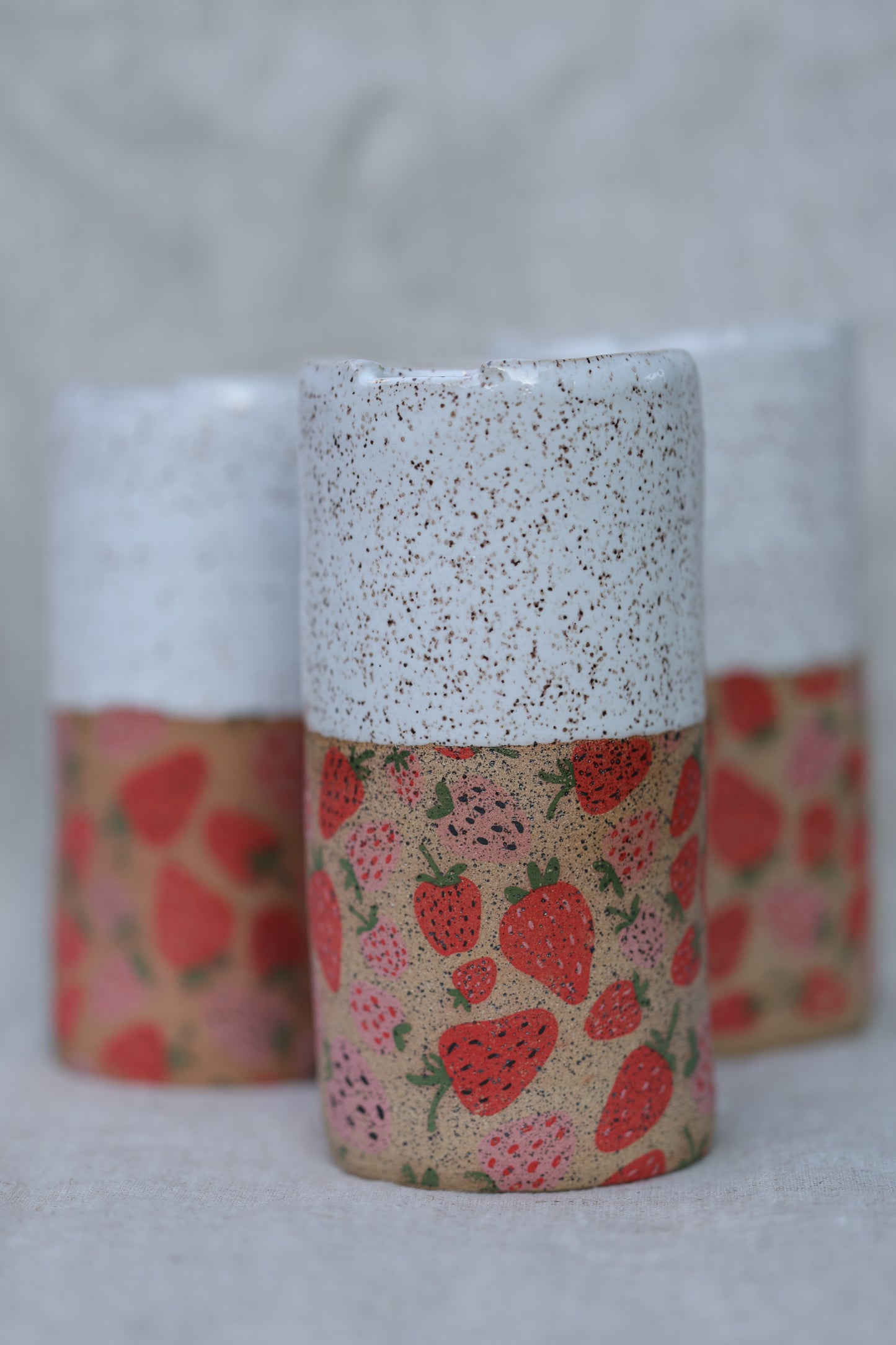Strawberry travel mug in white with speckled clay - appx 12-14oz.