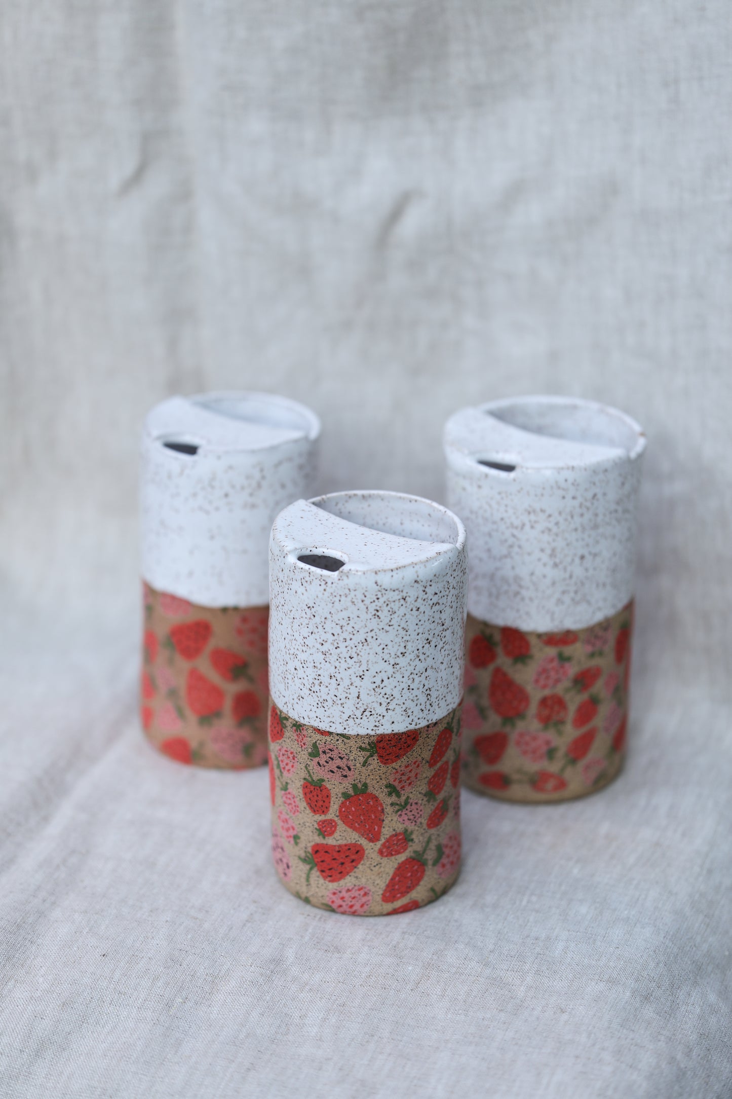 Strawberry travel mug in white with speckled clay - appx 12-14oz.